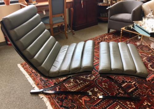SIGNED & NUMBERED BY DESIGN INSTITUTE OF AMERICA GRAY LEATHER CHAIR W/ OTTOMAN CHAIR: 28"W X 27"D X 35.25"H OTTOMAN: 28"W X 20"D X 17"H $2495